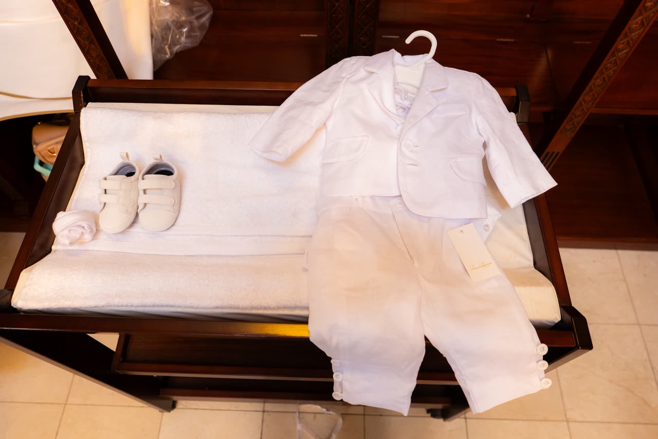 Christening outfit detail photographed before a Serbian Orthodox baptism in Melbourne