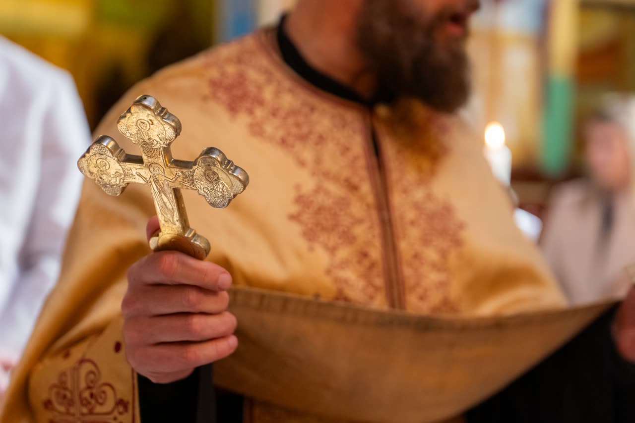 Orthodox cross detail photographed before a Serbian christening ceremony