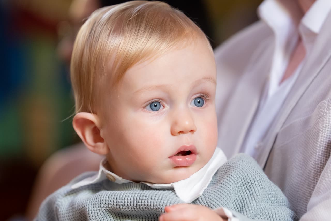 Baby emotional moment during christening coverage in Melbourne