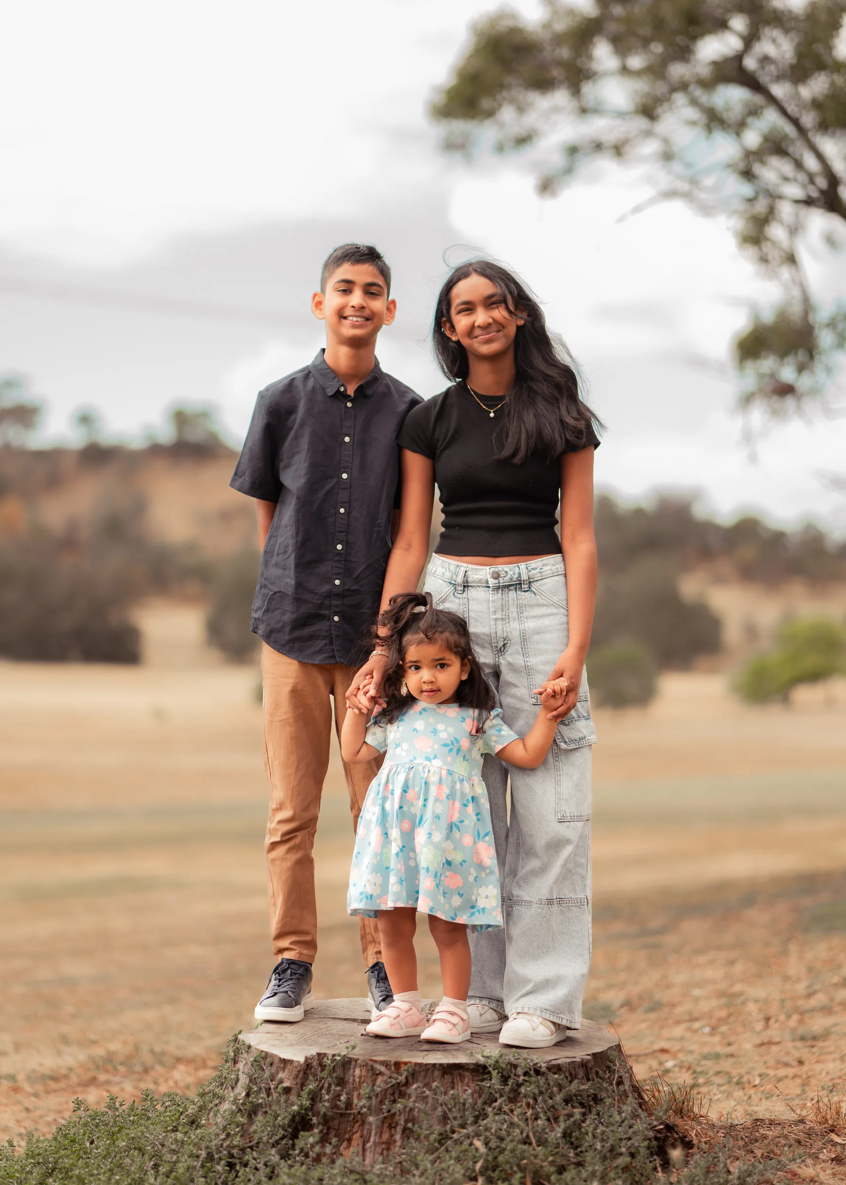 Family portrait in a park photographed by Royale Photography