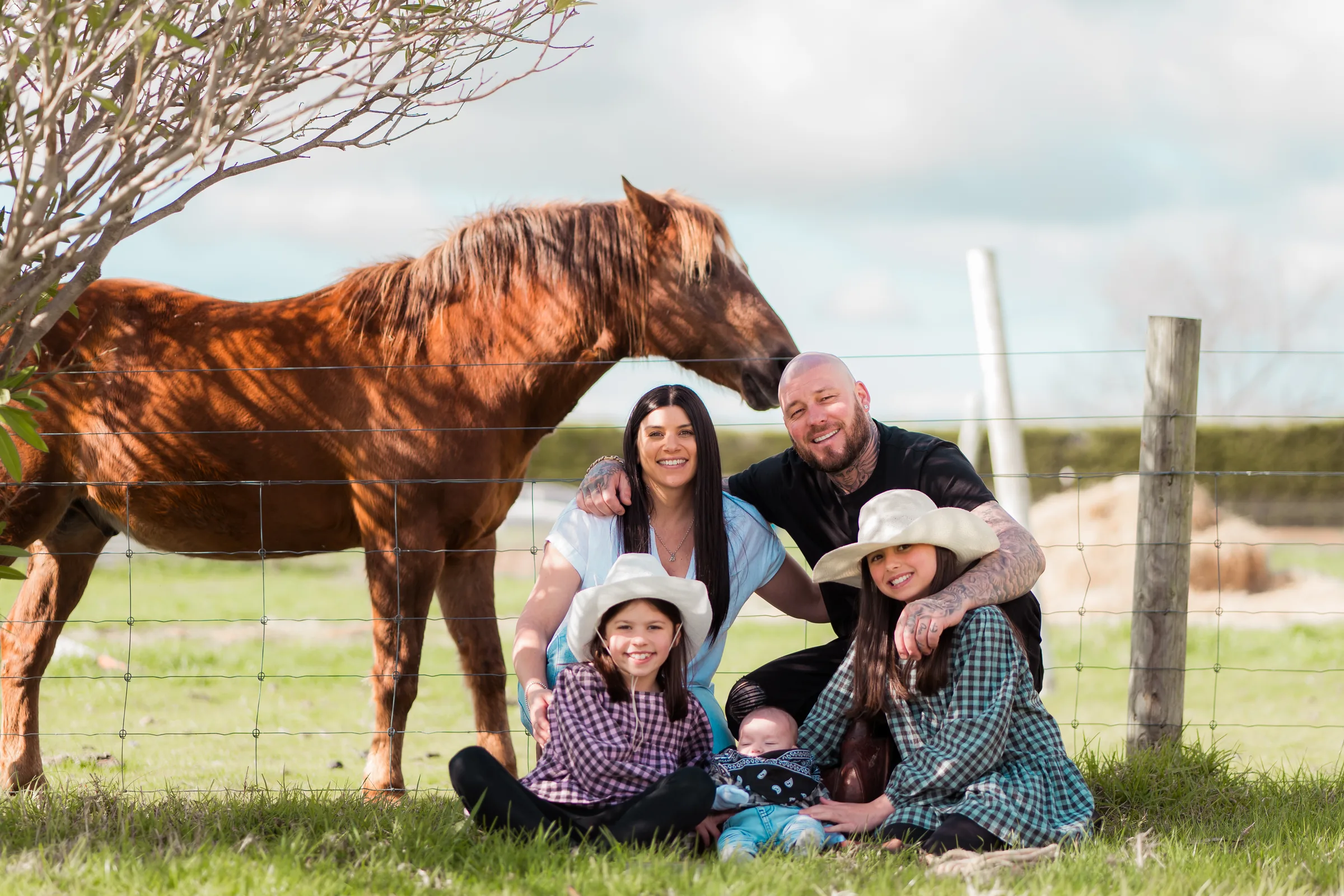 Rural family portrait with a horse photographed by Royale Photography